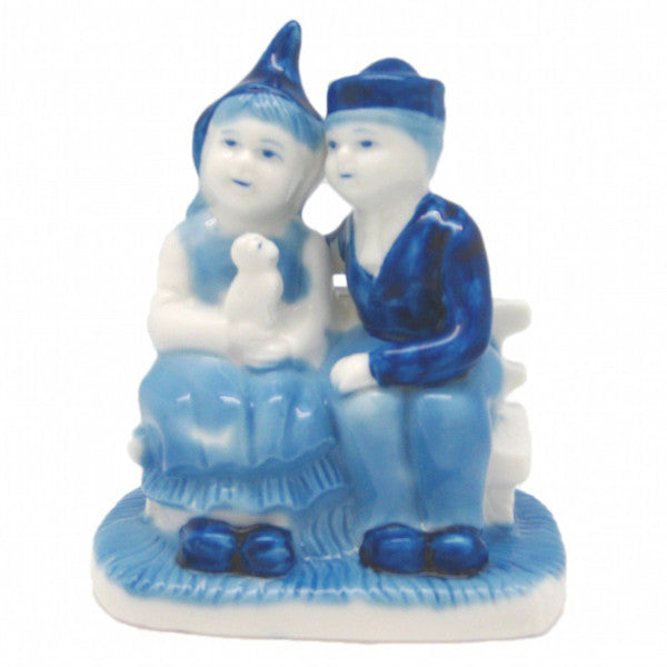 Blue & White Figurine: Dutch Couple Sitting on Bench - OktoberfestHaus.com
 - 1